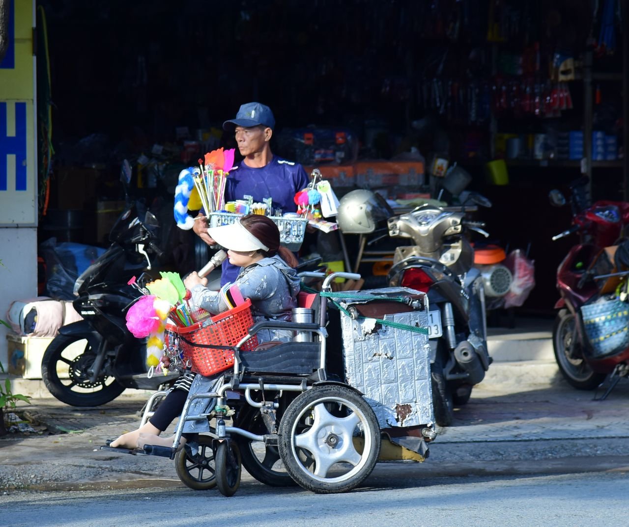 Vibrant street scene featuring vendors selling goods from carts in a bustling urban environment.